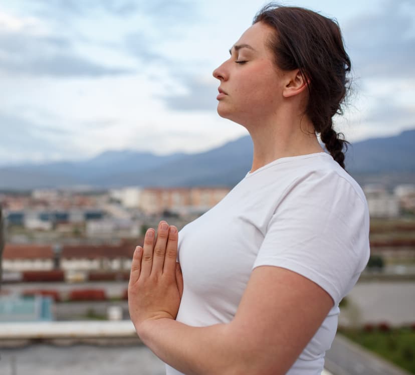 Woman practicing yoga outdoors