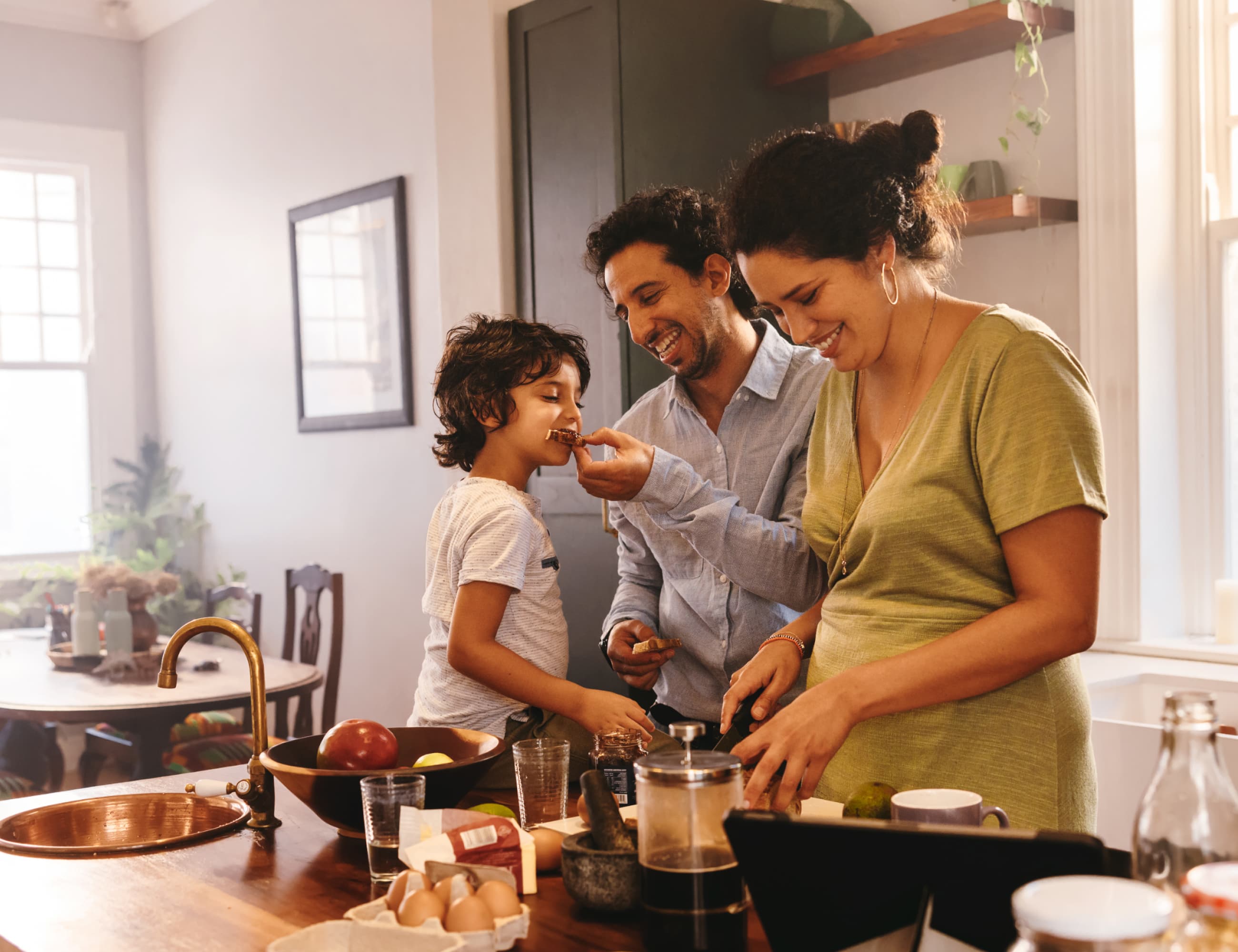 Family of three preparing a meal