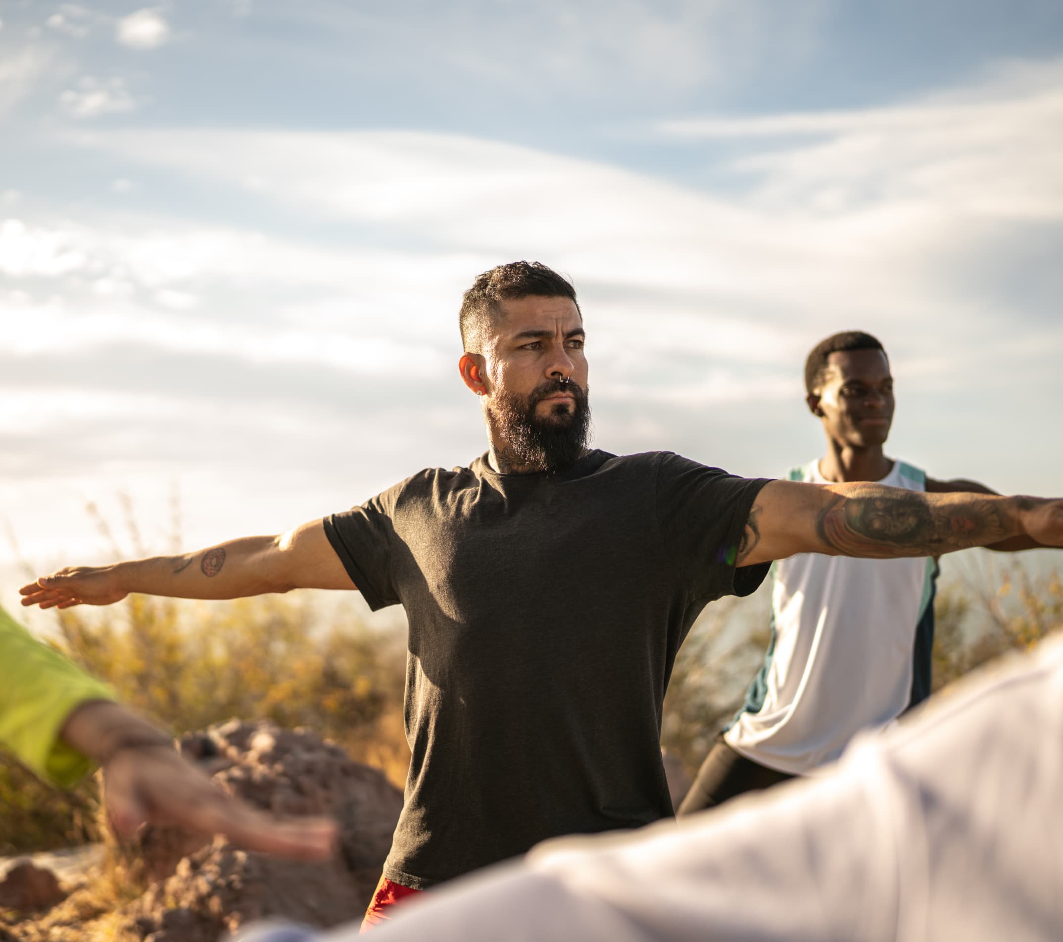 Man practicing yoga outdoors